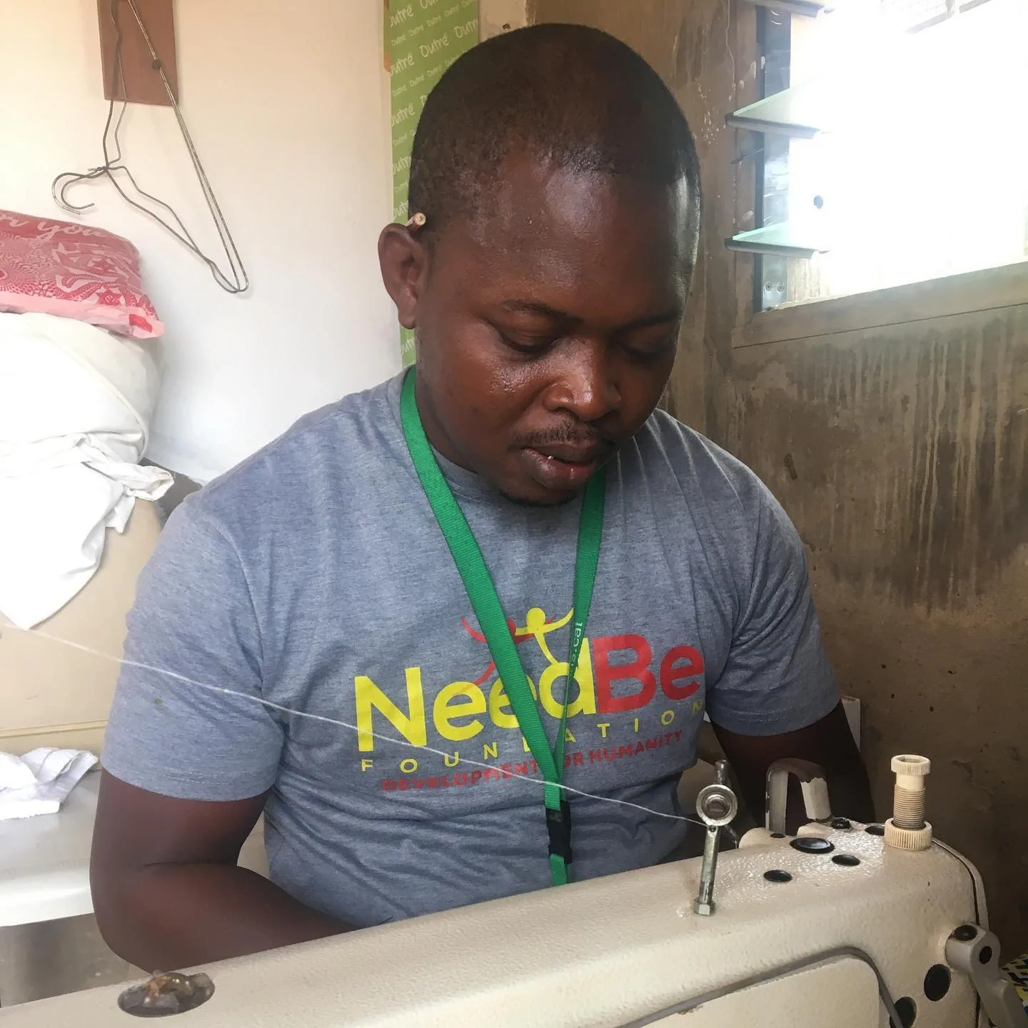 Ghanaian seamstress crafting NeedBe Reusable Pads